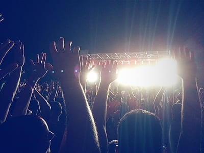 mass of people watching live concert during night time thumbnail
