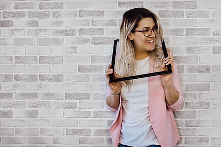 Woman Holding Black Photo Frame thumbnail
