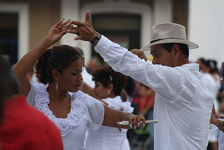 man and woman dancing surrounded by peaople thumbnail