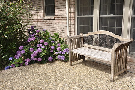 white wooden bench in front of glass window thumbnail
