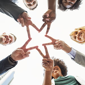 Group of People Forming Star on Their Hands thumbnail