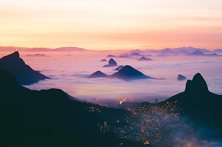 aerial photography of sea of clouds on mountain peaks thumbnail