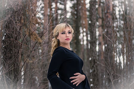 woman standing on forest thumbnail