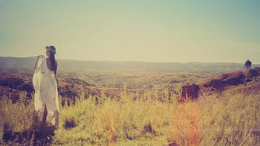 photo of woman wearing white dress during golden hour thumbnail
