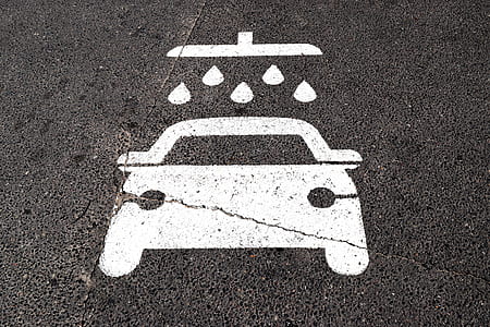 vehicle will get wet sign on gray asphalt surface thumbnail