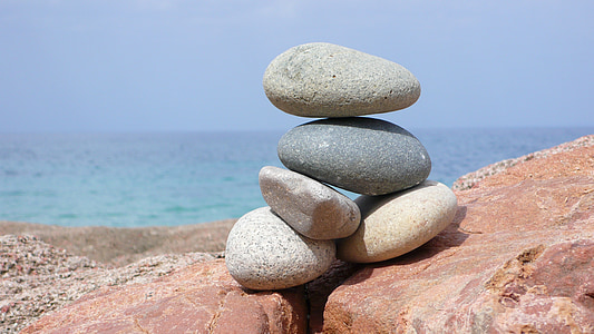 stacked stones in selective focus photography thumbnail
