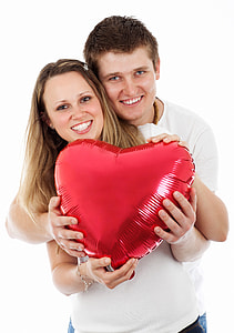 Couple holding heart balloon on Valentine's day thumbnail