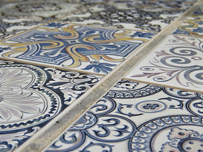 close up photo of white and blue floral tiles thumbnail