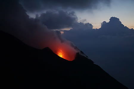 erupting volcano during sunset thumbnail