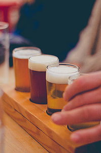 person holding glass full of drinks thumbnail