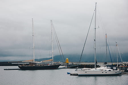 white yacht on body of water thumbnail