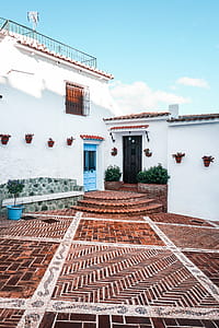 White Concrete House With Brown Tiled Yard thumbnail