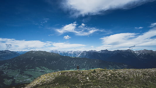 man in black shirt standing on cliff thumbnail