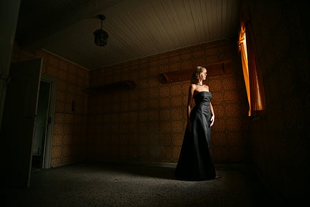 woman standing near window thumbnail