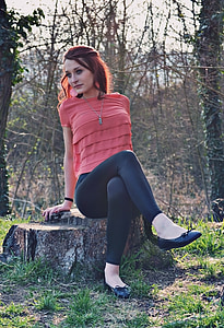 woman sitting on chopped tree thumbnail