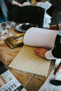 Golden photo frame and decorative paper on a table thumbnail