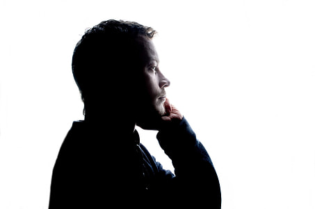 man wearing black long-sleeved top thumbnail