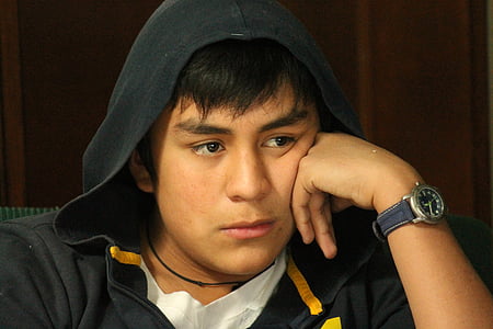 man in black hoodie wearing analog watch thumbnail