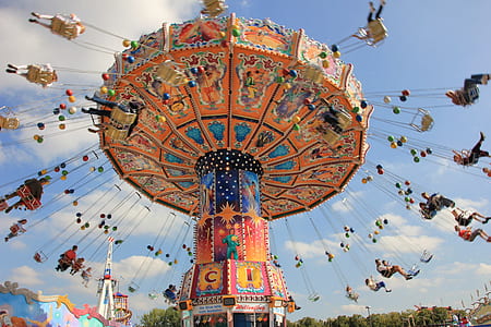 people in carnival ride during daytime thumbnail