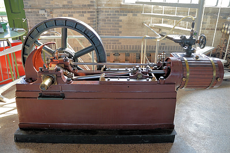 red lathe machine on gray floor thumbnail