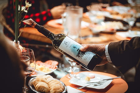 person pouring on wine glass thumbnail