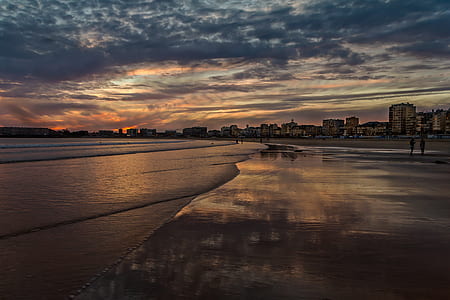 body of water under cloudy sky thumbnail