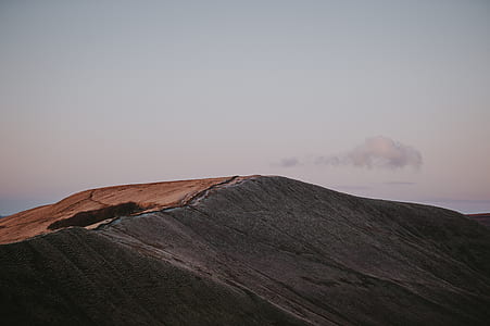 brown hill under white cloud blue skies thumbnail