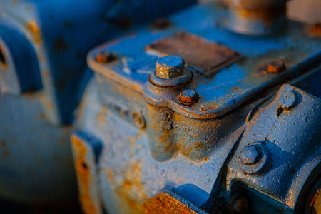 Close-up shot of a rusty blue-coloured engine. Image captured in Dungeness, Kent, England thumbnail
