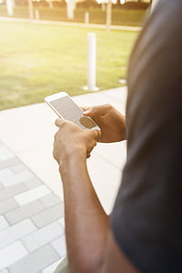 man holding iPhone thumbnail