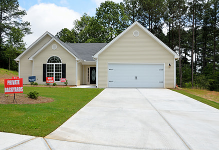white and beige garage closed thumbnail