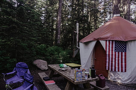 two purple camping chairs near picnic table thumbnail