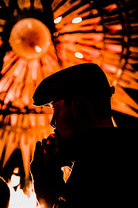 man on black shirt and hat near at red light thumbnail