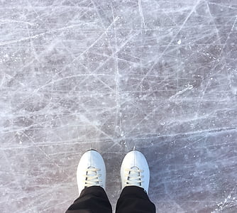 person wearing white shoes standing on gray surface thumbnail