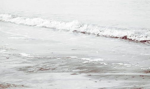 body of water wave on white sand thumbnail
