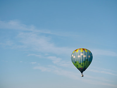 blue hot air balloon in mid air thumbnail