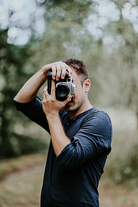 Photographer taking photos of a beautiful, young woman thumbnail