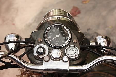 close-up photo of black motorcycle instrument cluster panel thumbnail