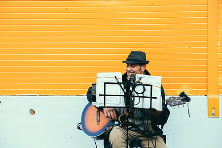 man playing guitar at the street thumbnail