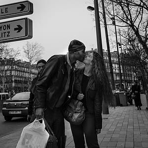 grayscale photo of man and woman kissing thumbnail