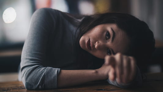 shallow focus photography of woman pointing camera thumbnail