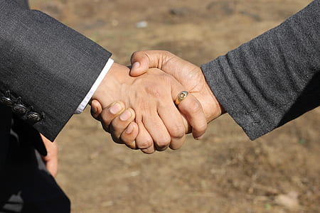 handshake between to person near soil thumbnail