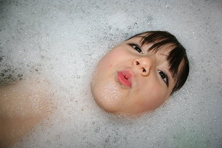 child taking bath with bubbles thumbnail