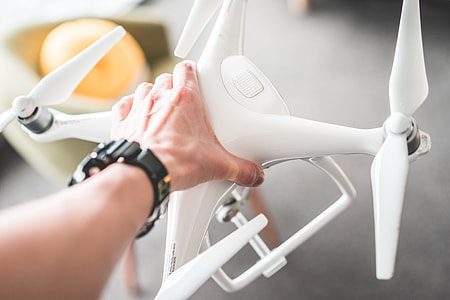 Man Holding a Drone in Hands thumbnail