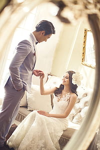woman and man in wedding attire thumbnail