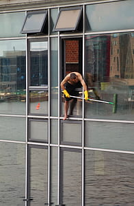 man cleaning window thumbnail