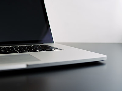 MacBook Pro on black surface thumbnail
