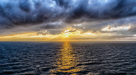 photo of ocean during sunset thumbnail
