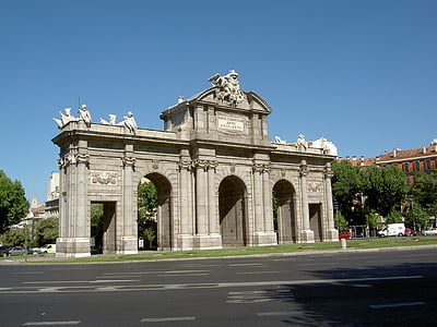concrete entrance gate near paved road thumbnail