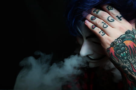 man with left hand tattoo smoking cigarette thumbnail