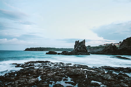 Photo Of Seashore With Rocks During Daylight thumbnail